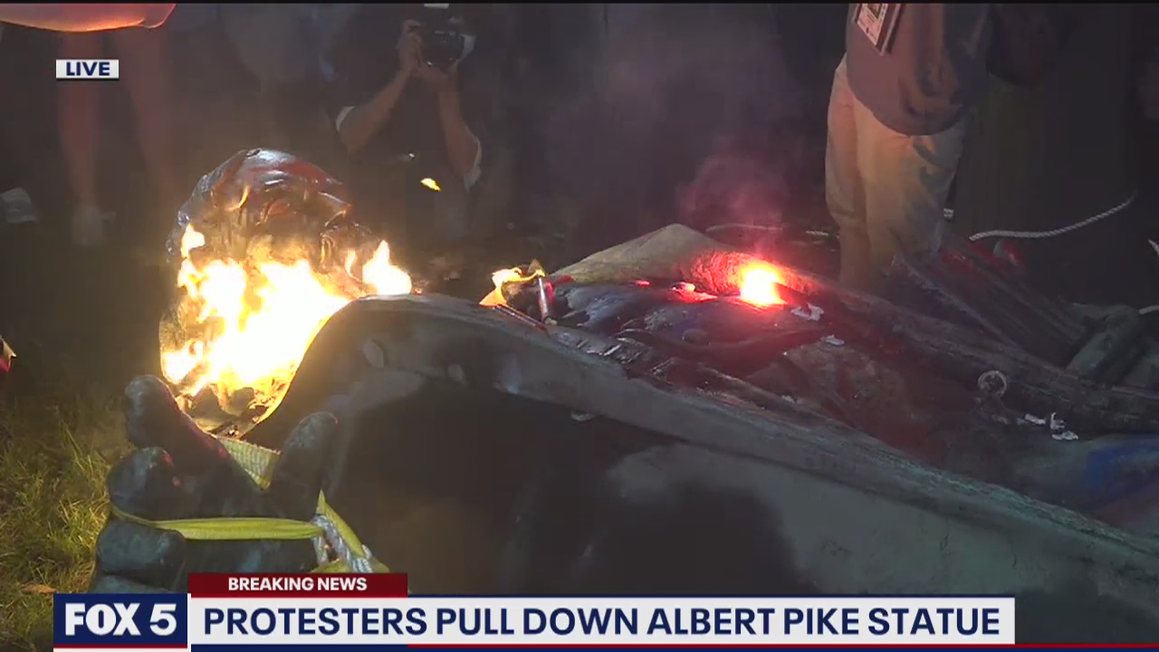 Protesters pull down and torch Confederate general statue in DC