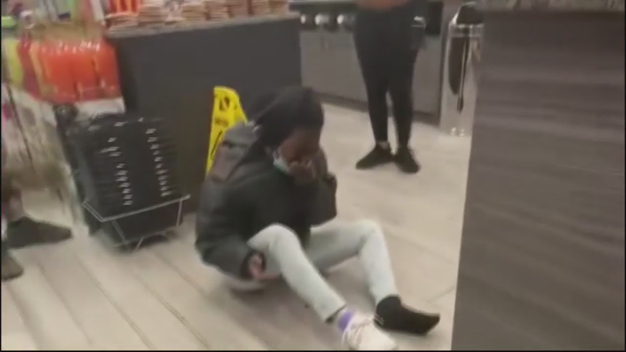 Supporters rally behind liquor store owner accused of assaulting woman who spit on him