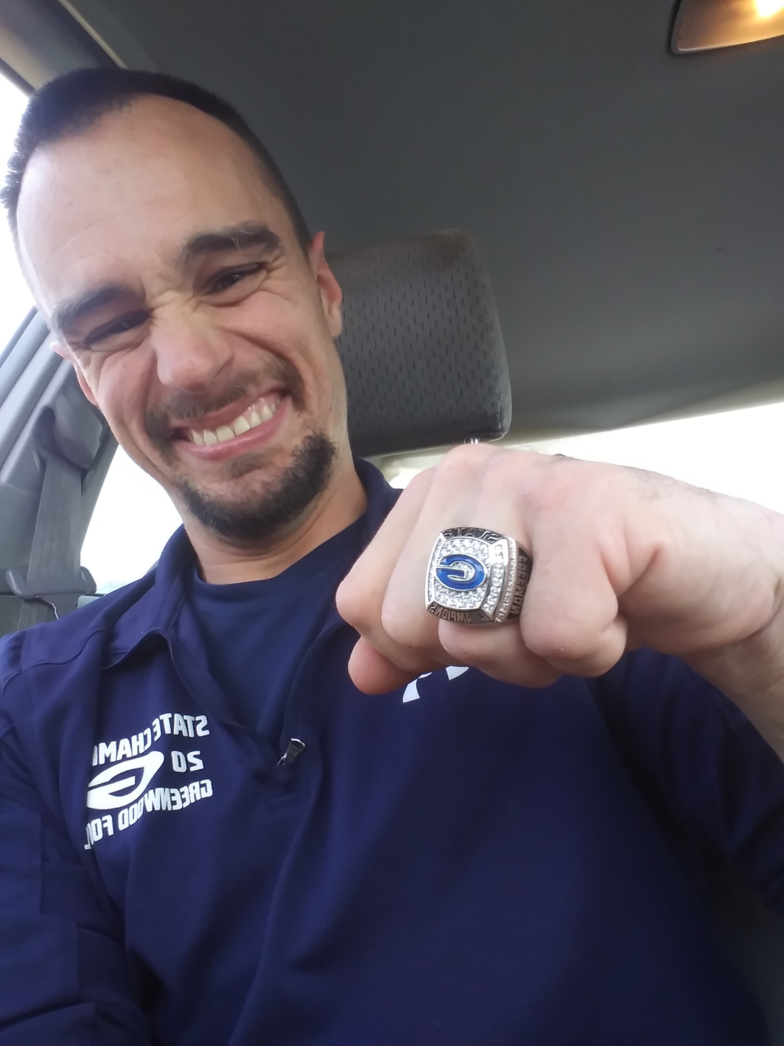 High school football team awards disabled janitor with championship ring