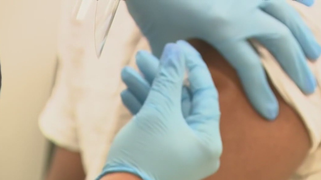 Doctors studying if vaccine helps relieve ongoing COVID symptoms