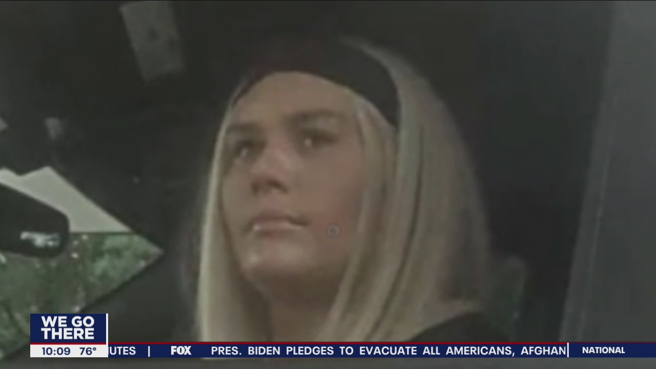 Police search for woman accused of using someone's identity to steal thousands of dollars