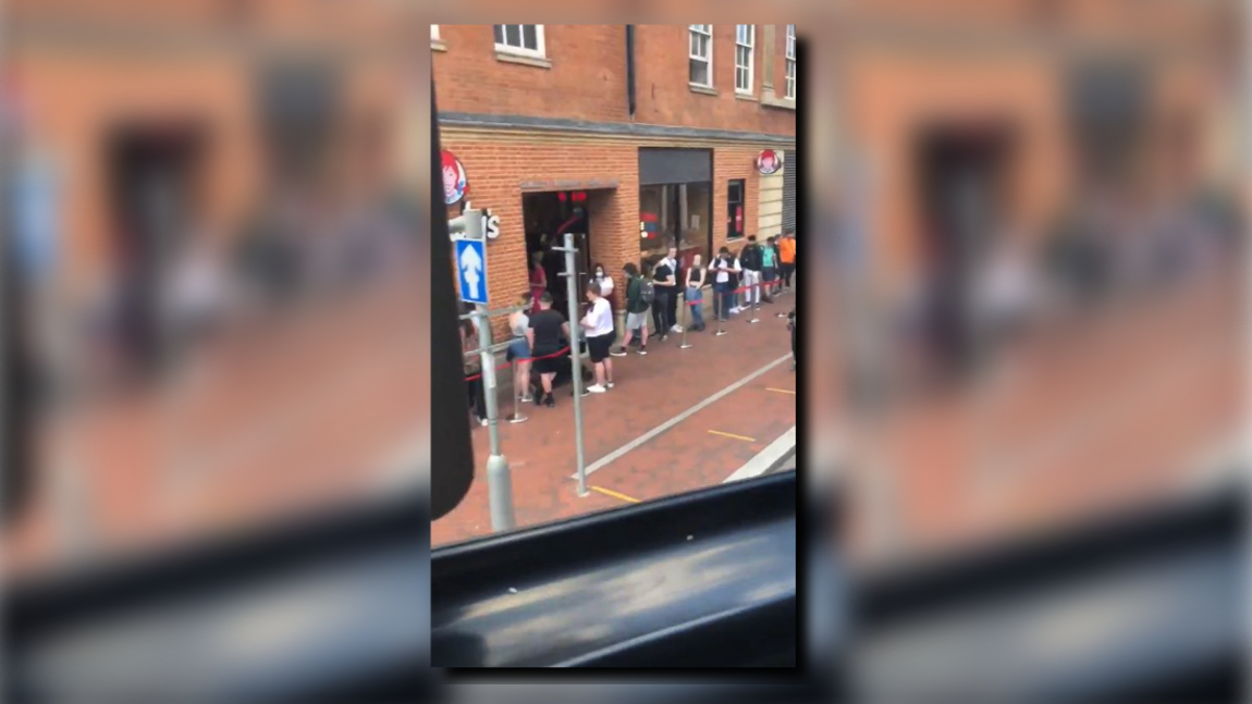 Long line waits to get inside British Wendy's