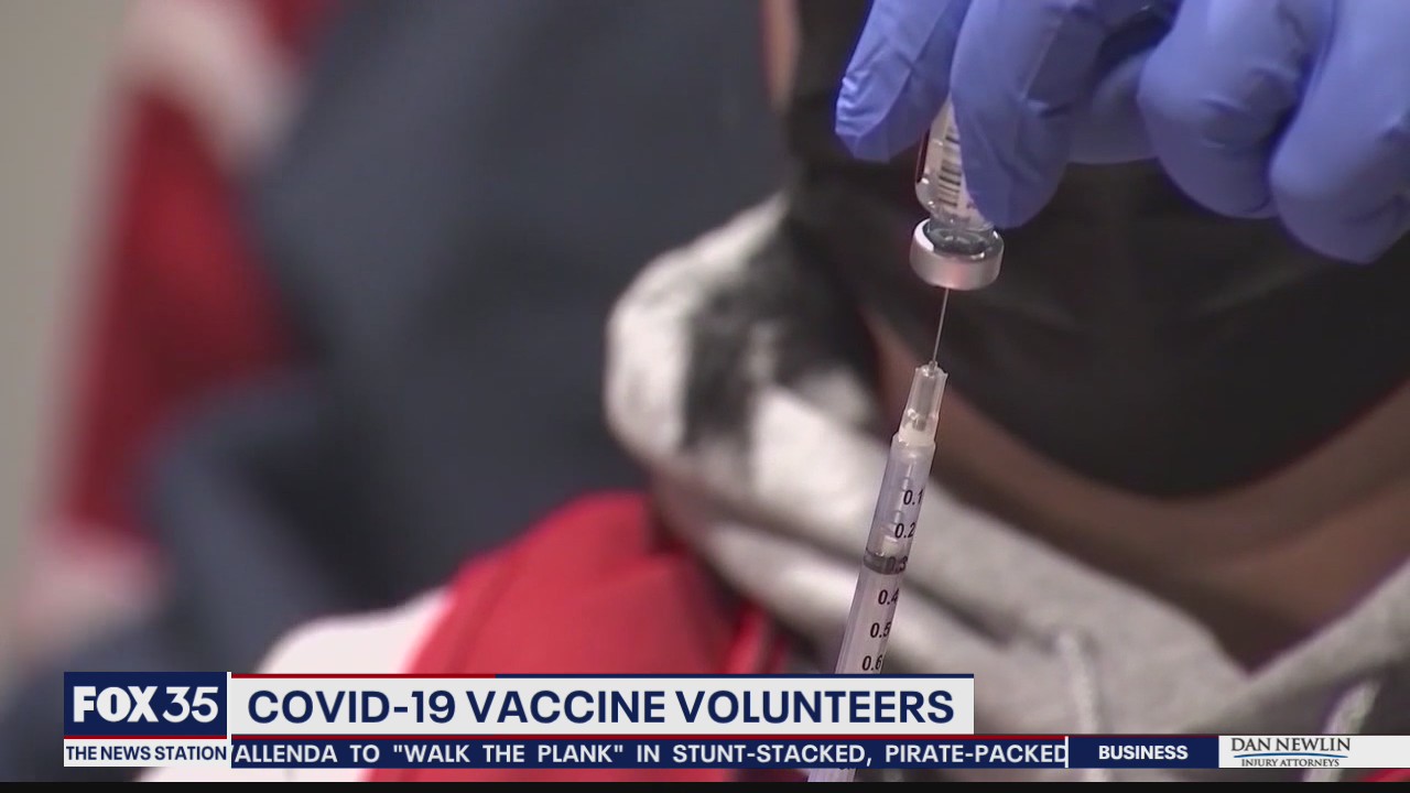 Volunteers help distribute COVID-19 vaccines