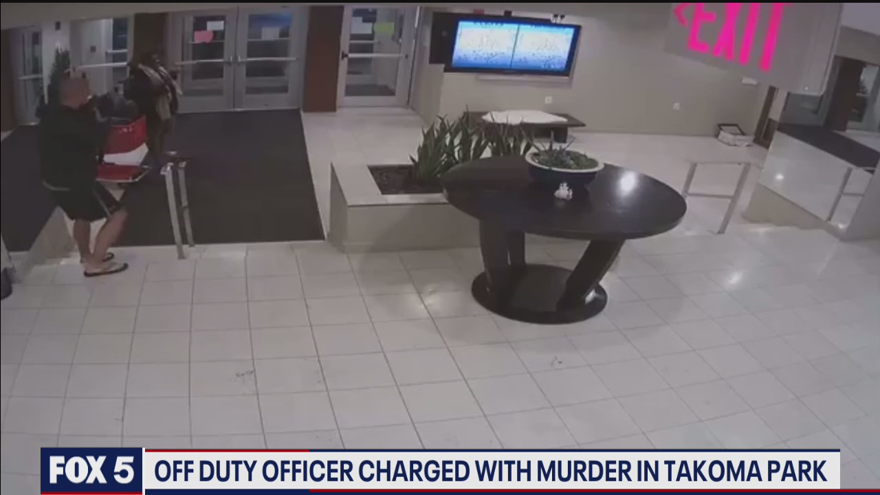 Video shows Pentagon police officer charged in 2 murders draw gun during previous incident