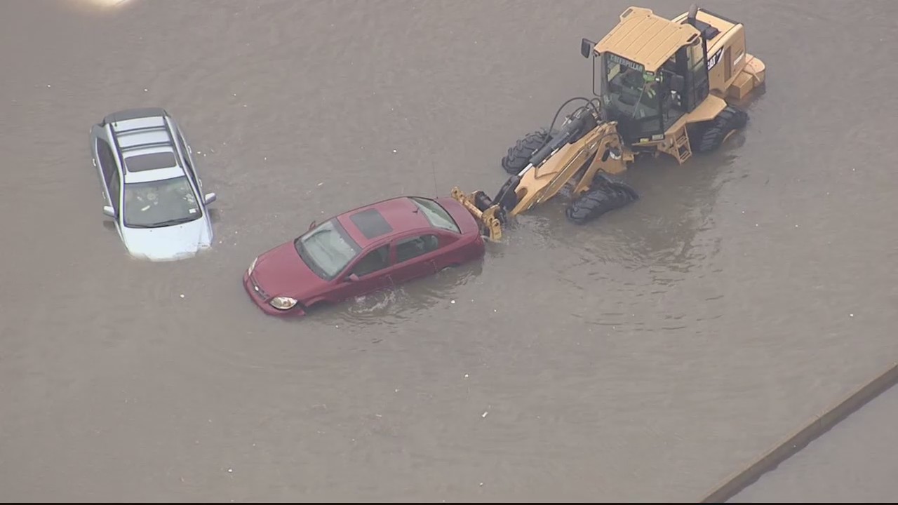 Drivers face struggle getting towed vehicles back after freeway flooding