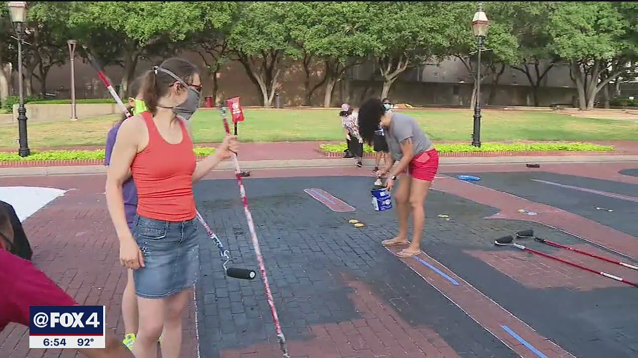 Community members help paint ‘End Racism Now’ on Fort Worth street