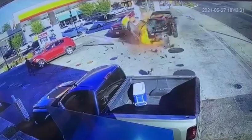 Vehicle crashes into gasoline pump, starts fire