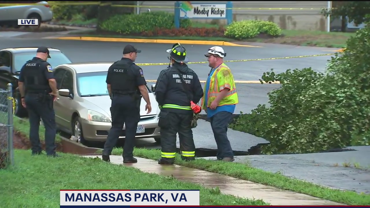 Vehicles damaged after part road collapses after heavy rain in Manassas Park
