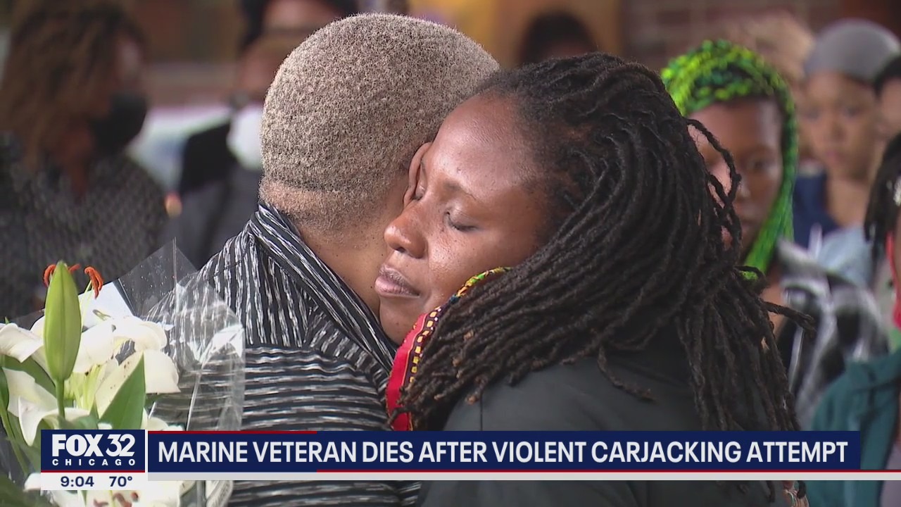 Community grieves at vigil for Marine veteran who died in carjacking attempt