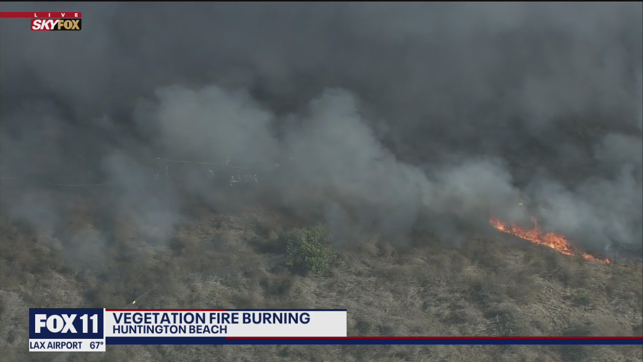 Crews battling fire in Huntington Beach