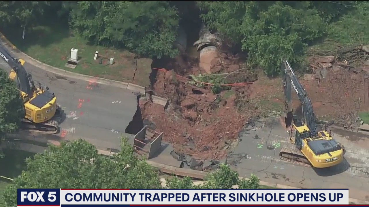 Community trapped after sinkhole opens up