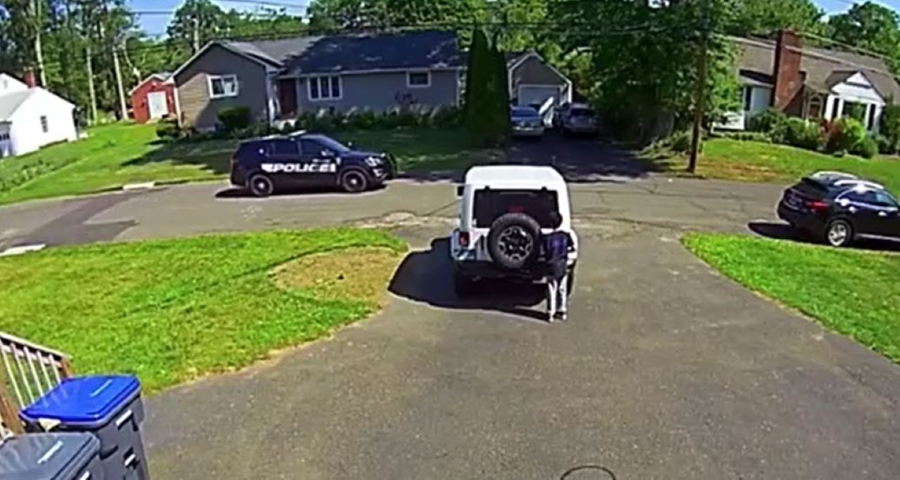 Video shows 10-year-old hiding from passing police car while playing basketball