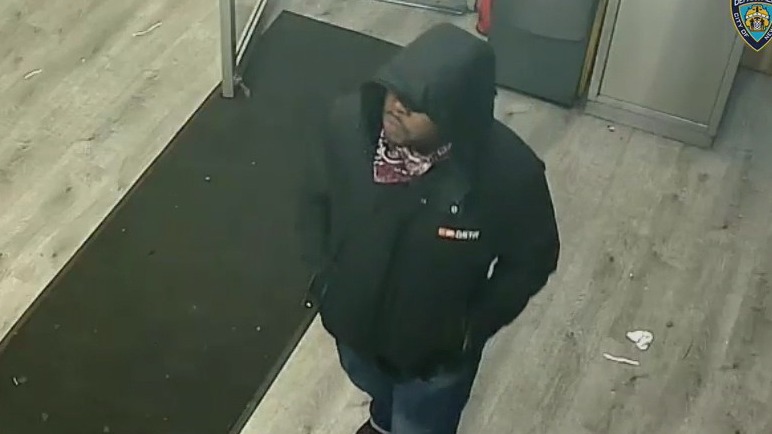 Robber beats patron for $2