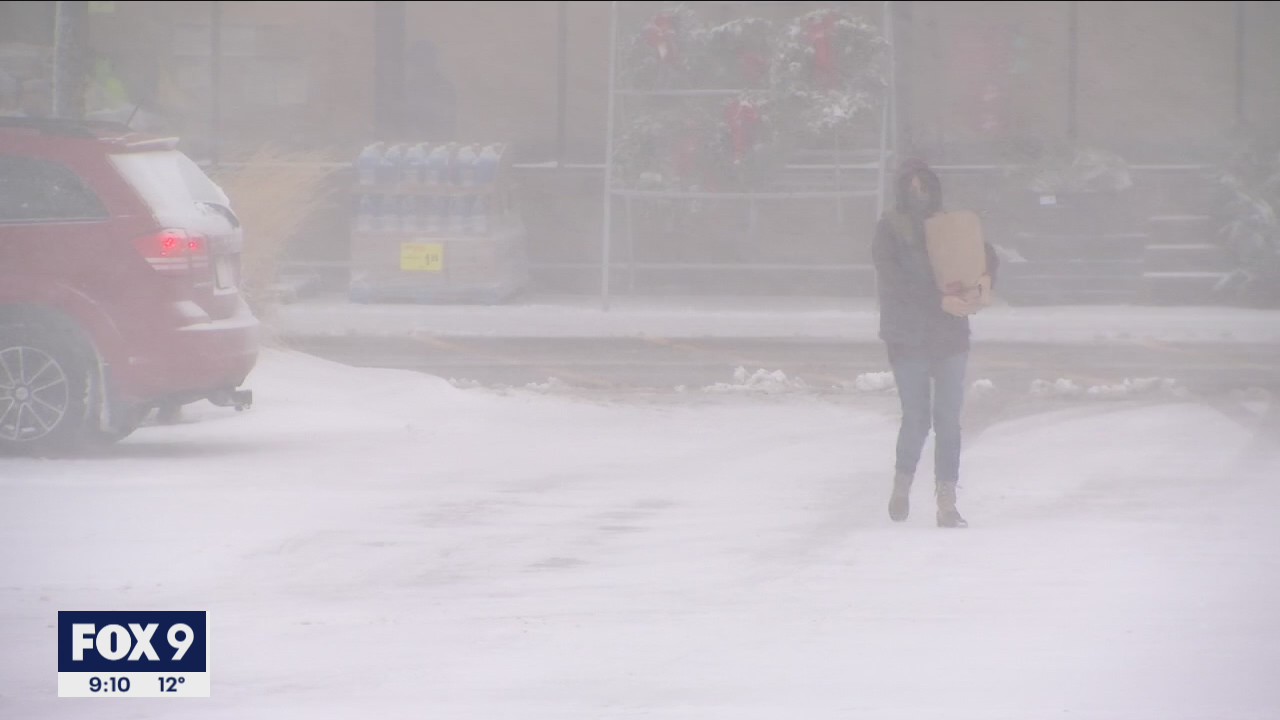 Last-minute shoppers in Minnesota trudge through snowstorm