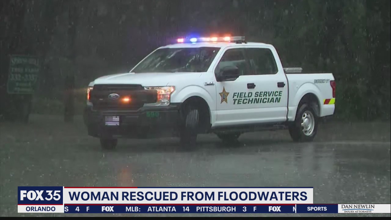 Woman rescued from floodwaters