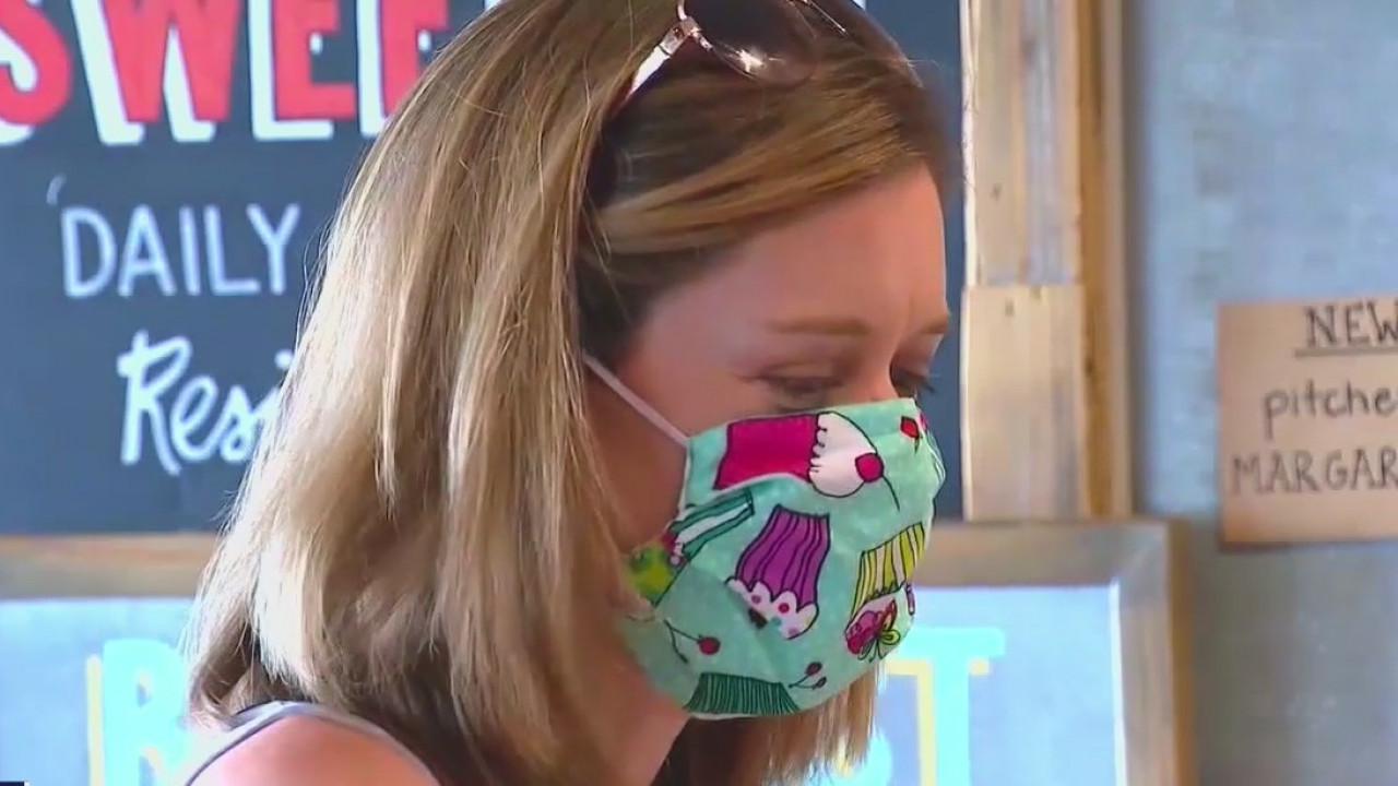 Vaccinated Americans weigh risks of going into public without masks