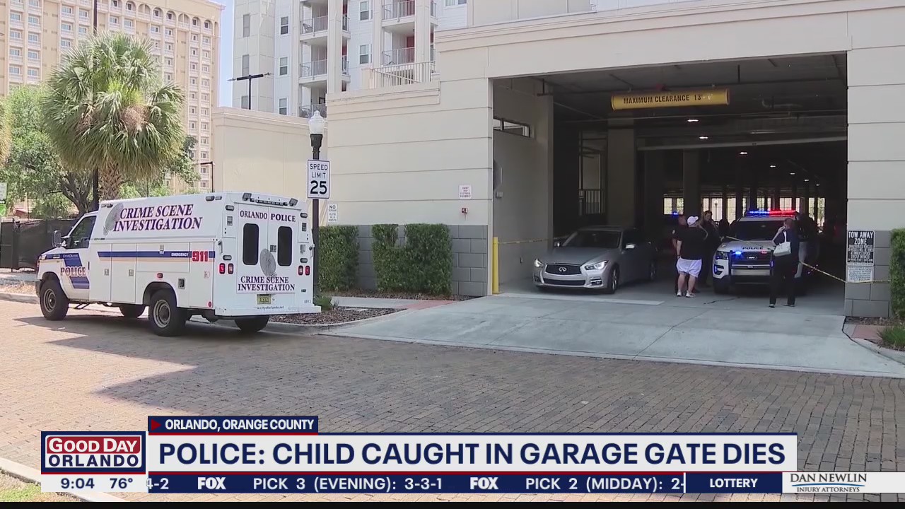Police: Child caught in roll-up parking garage gate has died