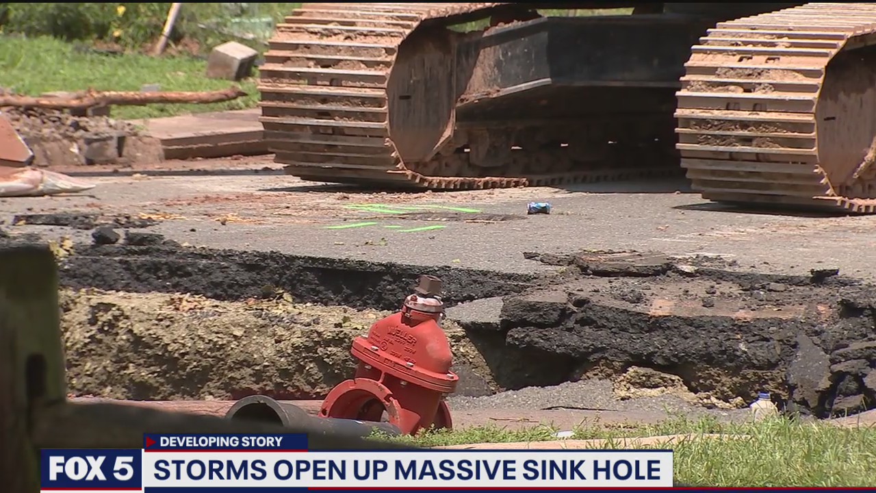 Storms open up massive sinkhole