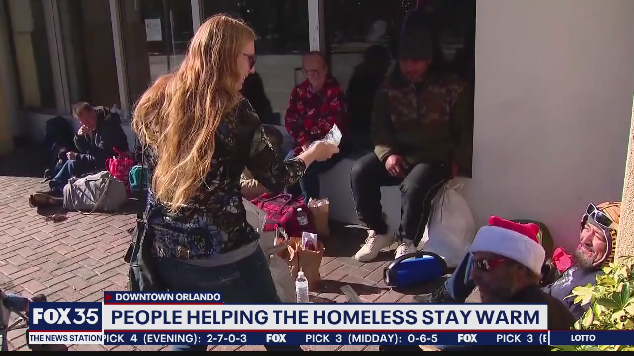 Family helps homeless at Lake Eola Park