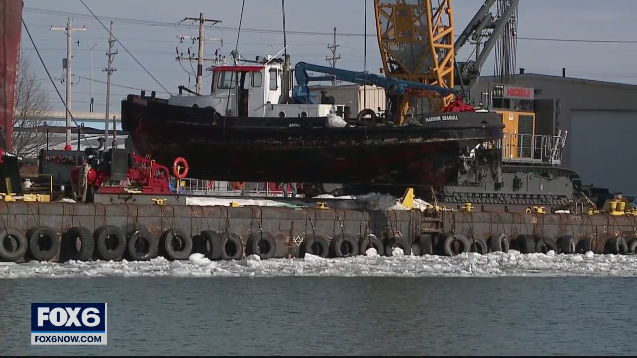 Crews retrieve Port workboat Harbor Seagull from river bottom