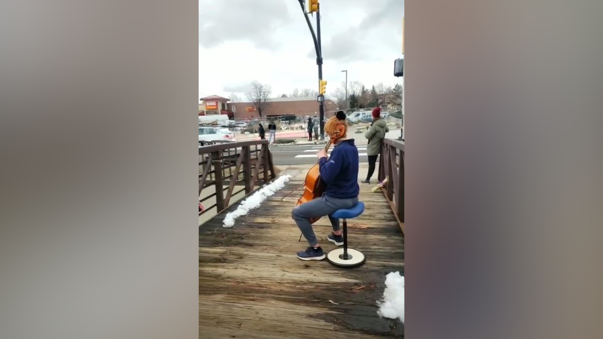 Cellist plays as mourners leave flowers for Colorado mass shooting victims