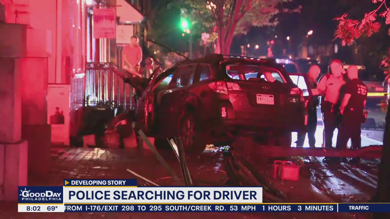 Police searching for driver of car that leapt curb and burst into flames