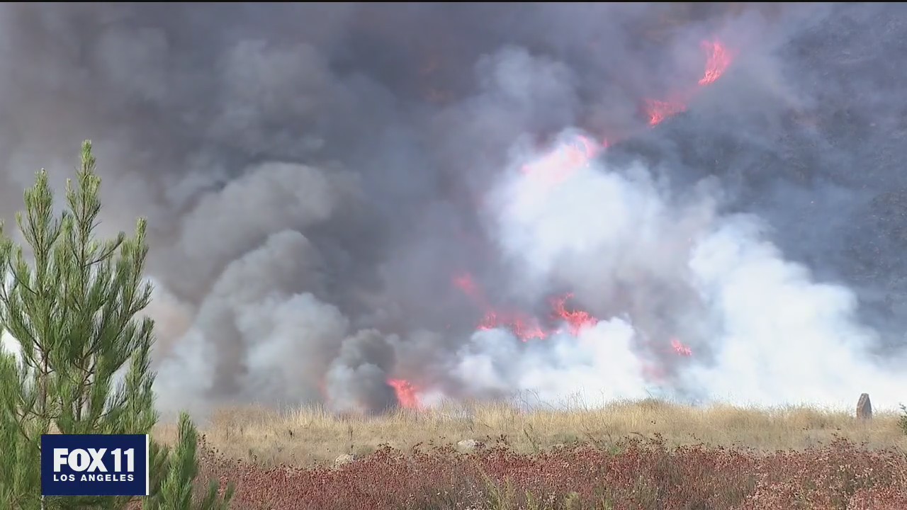 Crews continue to battle large brush fire in San Bernardino County