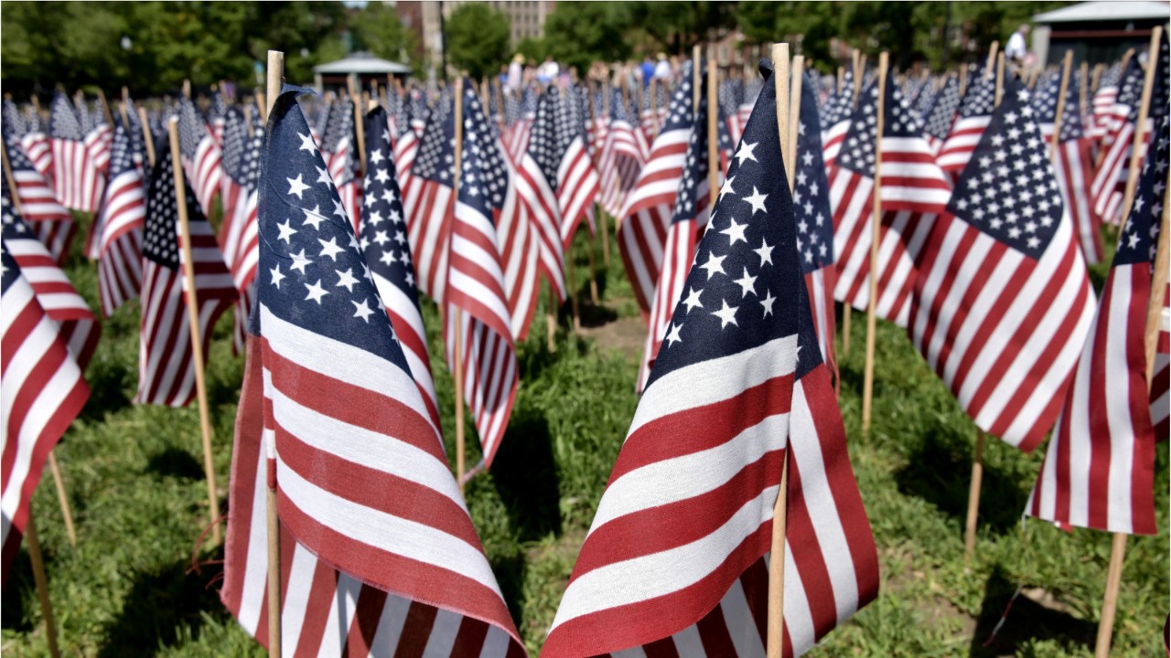 Man burned American flag, threw it on police vehicle, spat on officer, police say