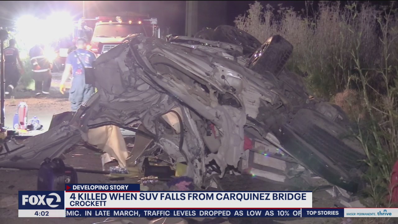 4 dead when SUV goes over freeway and crashes onto parked train