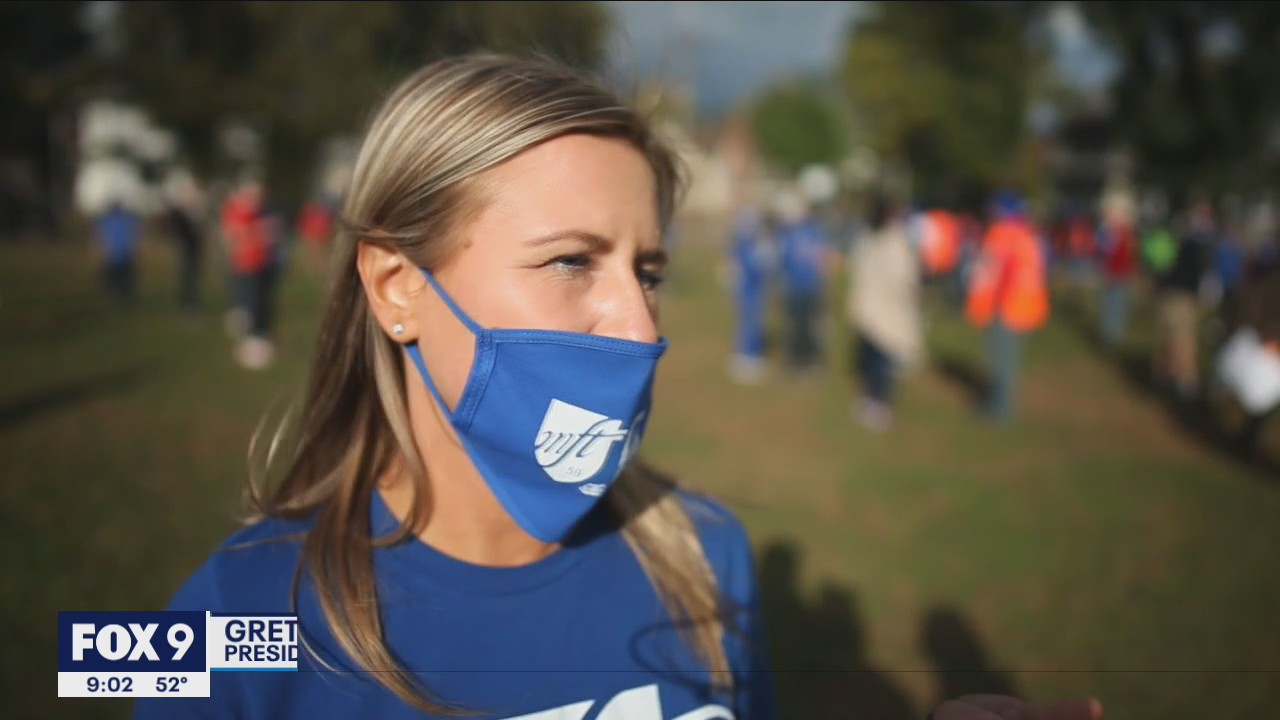 Frustrated Twin Cities teachers march together on Lake Street bridge