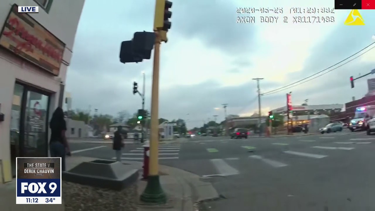 Body camera video shows witnesses in car with Floyd reacting to arrest in distance