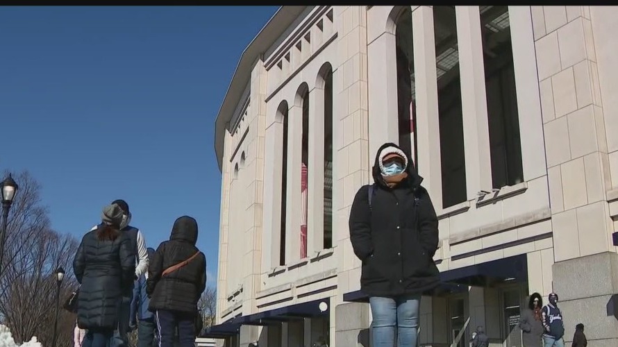 Bronx residents wait in long lines to get vaccinated at Yankee Stadium