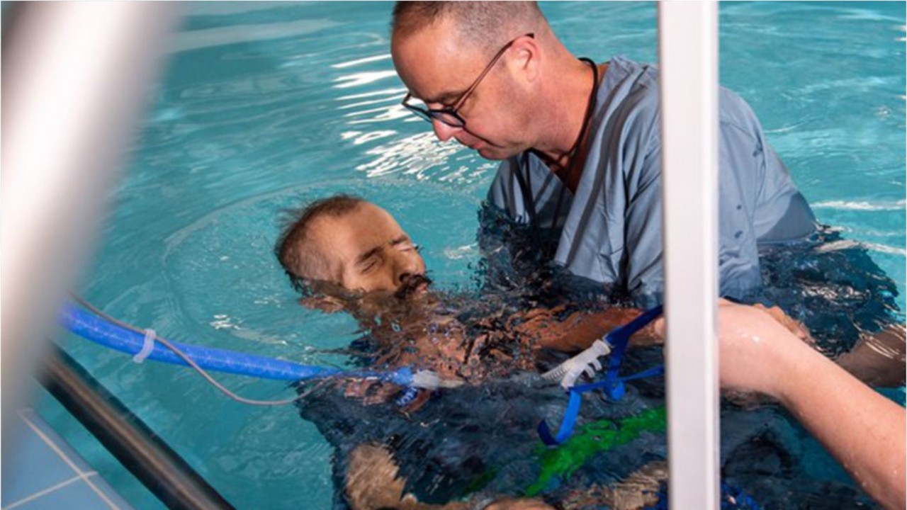 Wheelchair-bound Alabama man who is dying of cancer gets baptized as final request