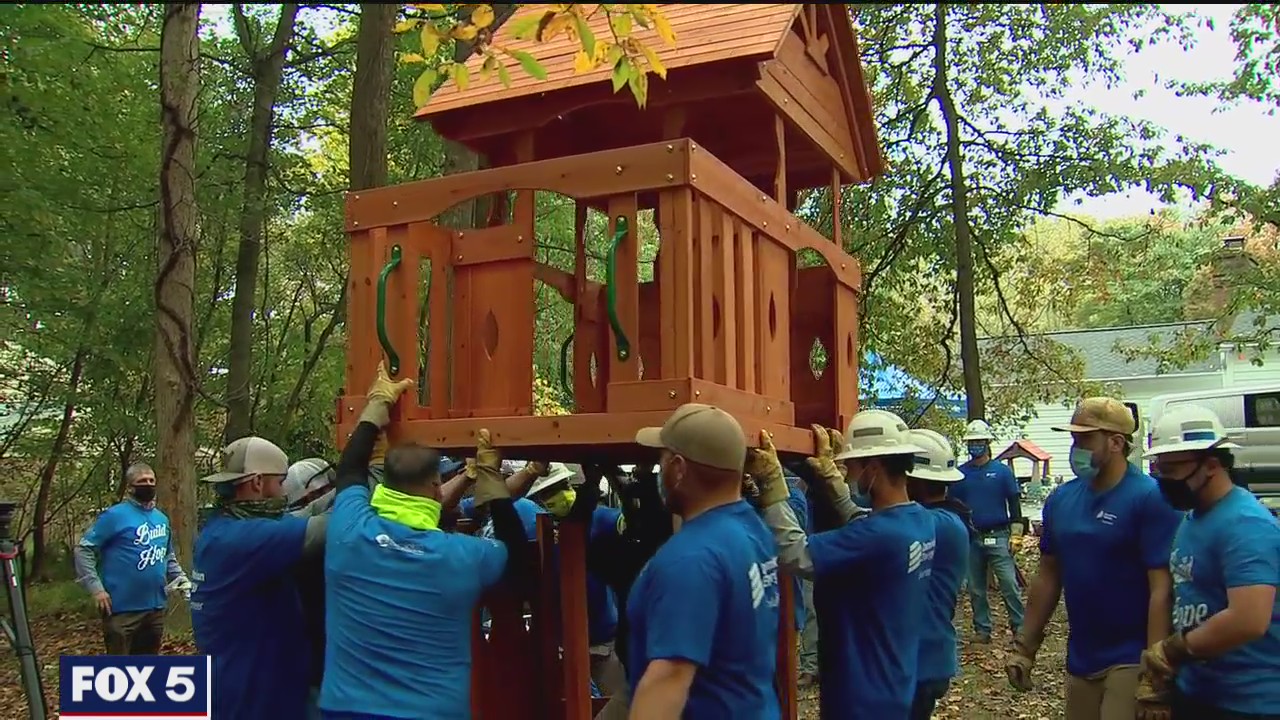 Volunteers build playset for young girl battling leukemia