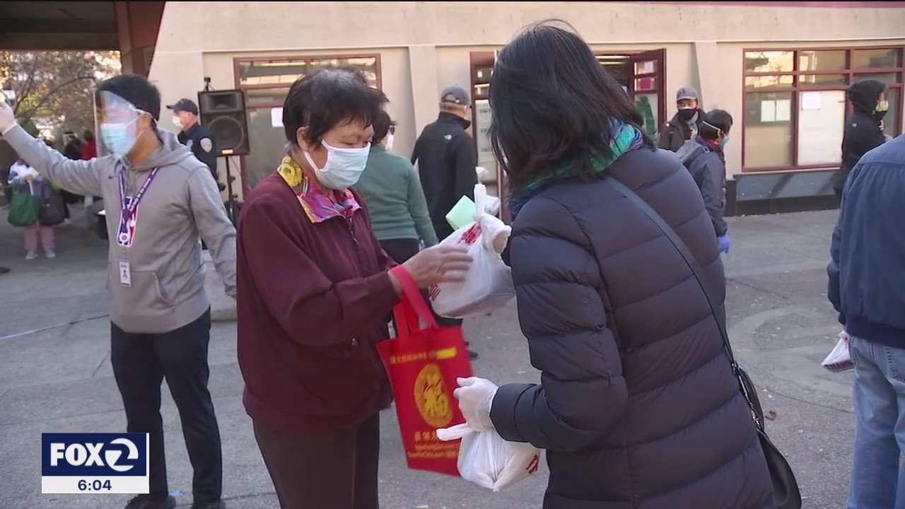 San Franciscans pass out warm holiday meals, PPE