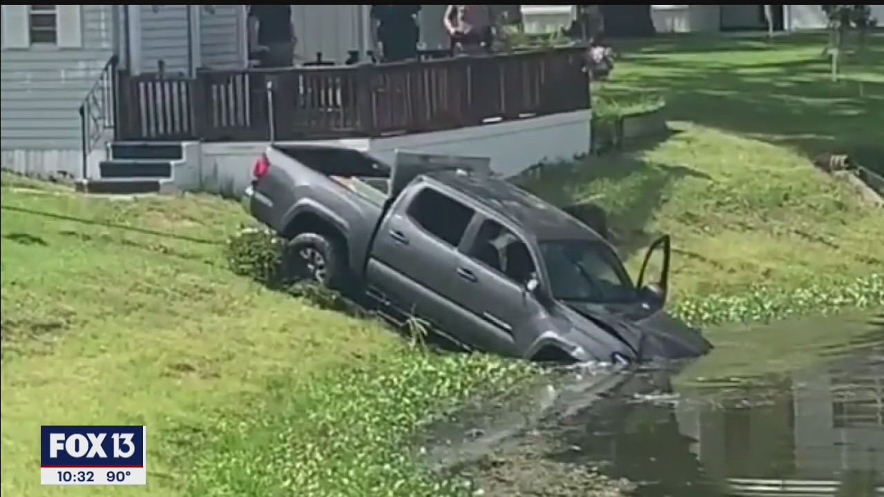 Good Samaritans rush to help after a vehicle went into a pond