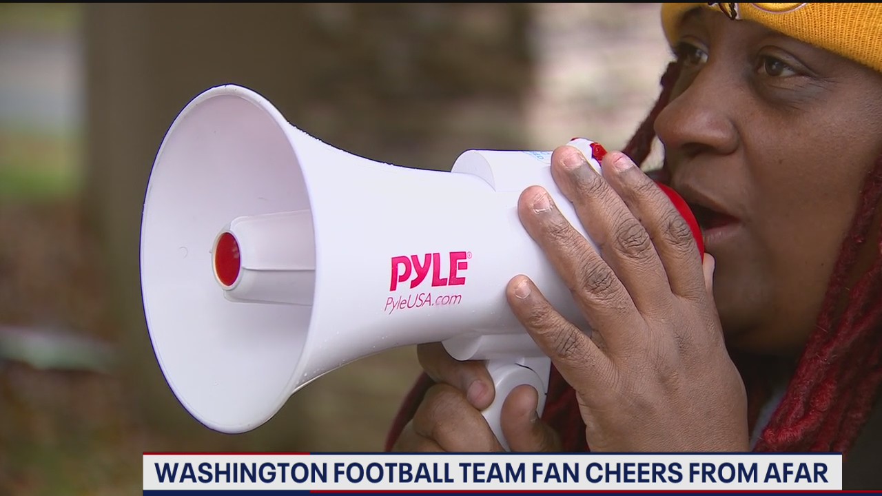Washington Football Team super fan cheers from afar