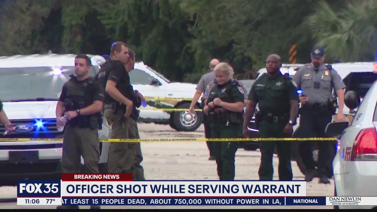 Officer shot while serving warrant