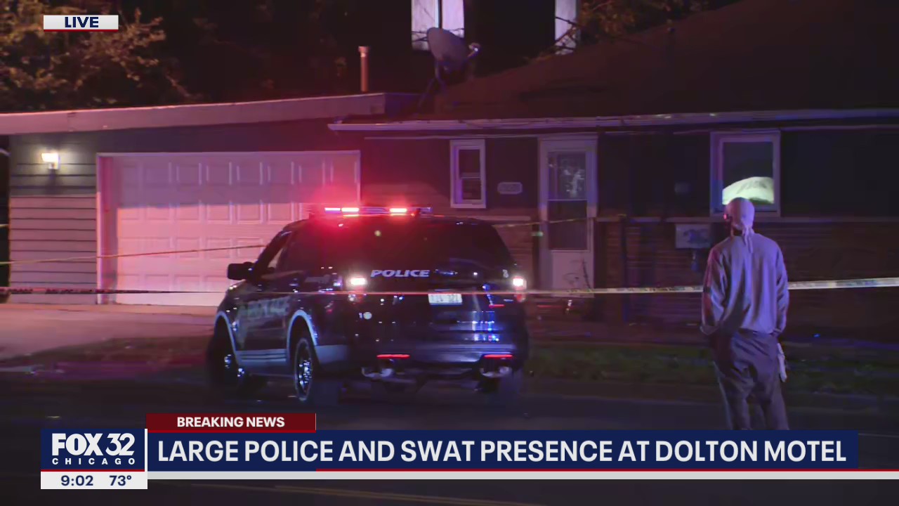 Police surround south suburban motel