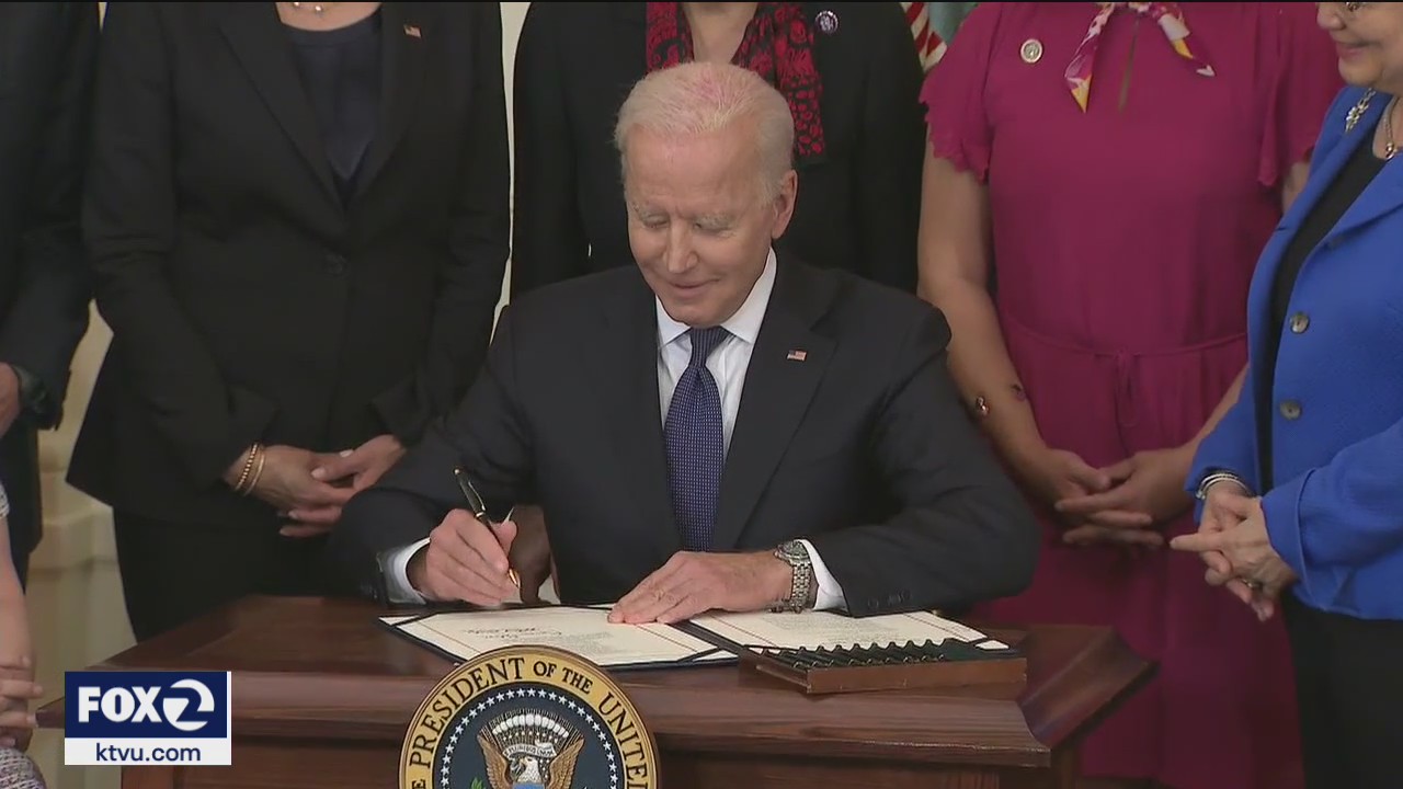 Biden signs bill to counter rise in anti-Asian hate crimes