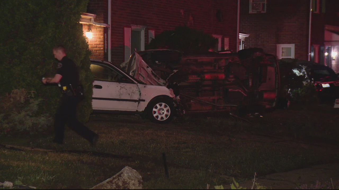 Neighborhood camera catches car crashing, flipping over onto parked vehicle