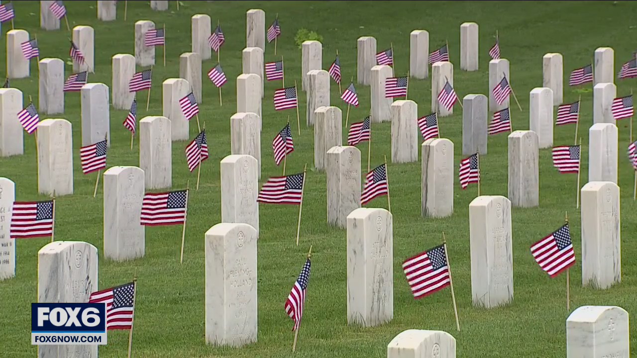 Flags placed on graves at Wood National Cemetery