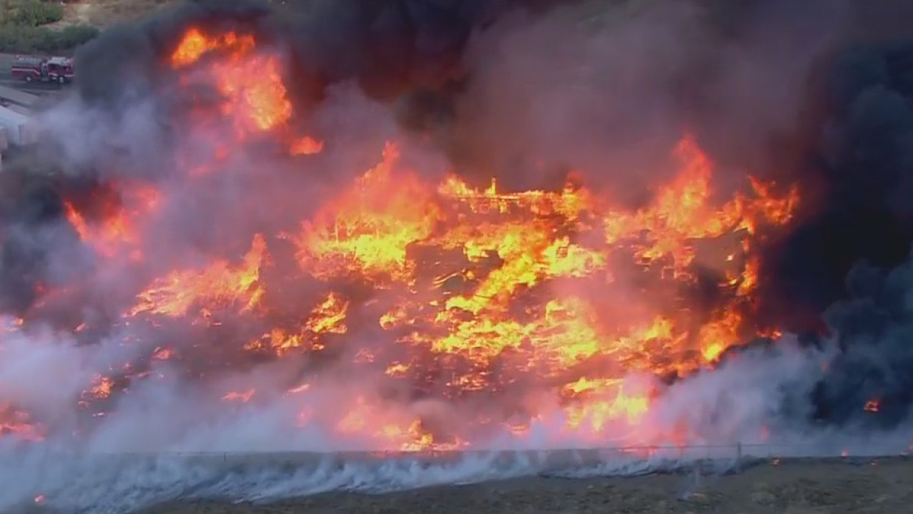 Crestmore Fire breaks out in Jurupa Valley, setting nearby pallet yard ablaze