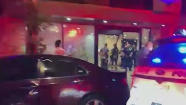 Woman drives car into hotel lobby