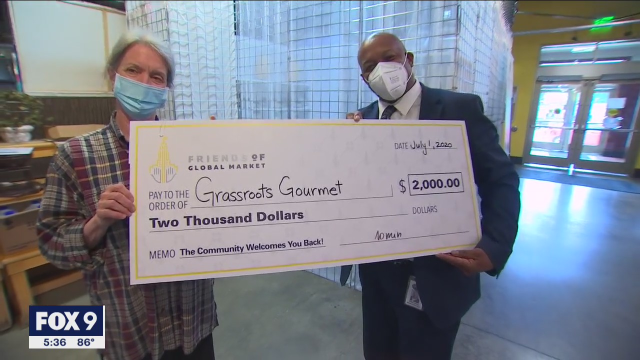 Midtown Global Market business owners surprised with checks to help them rebuild after riots