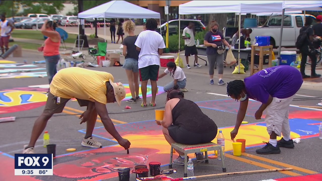 Artists paint 'Black Lives Matter' mural onto Plymouth Avenue in Minneapolis