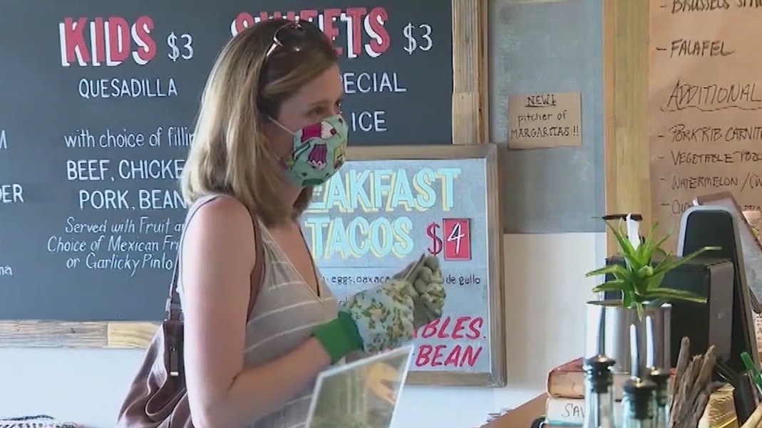 CDC recommends vaccinated people wear masks indoors