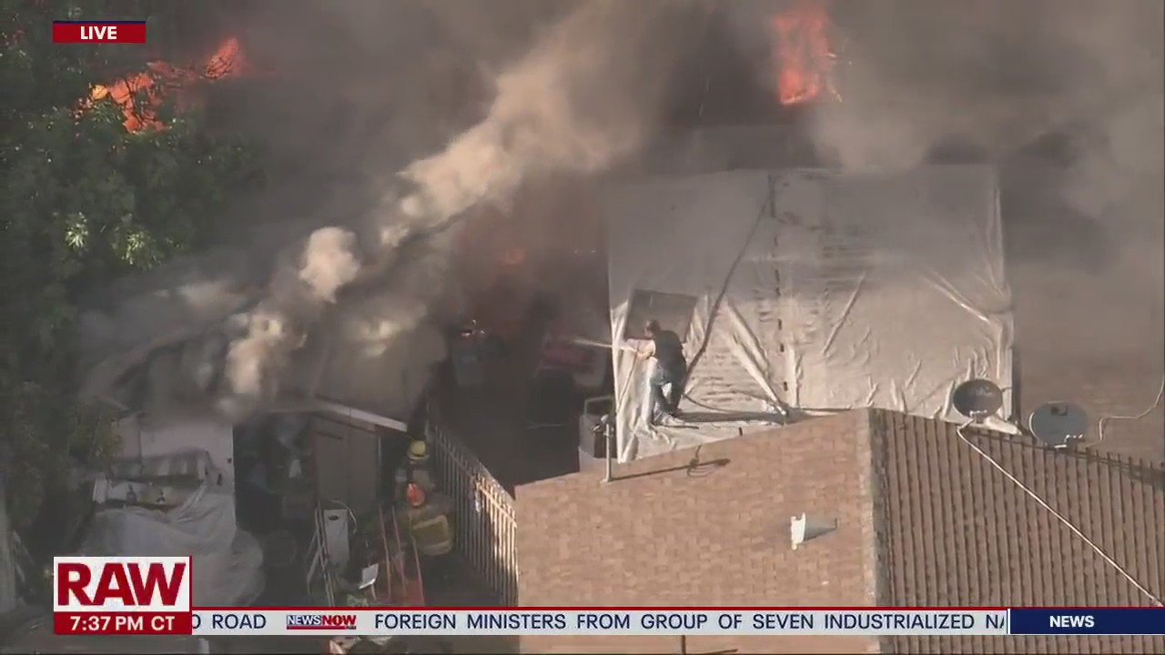Man fights fire with garden hose in South Los Angeles