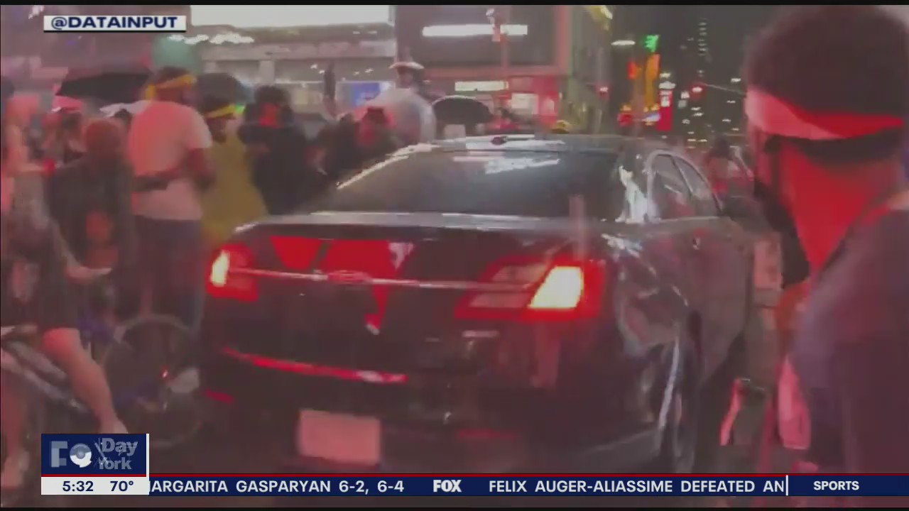 Cops search for car that rammed protesters