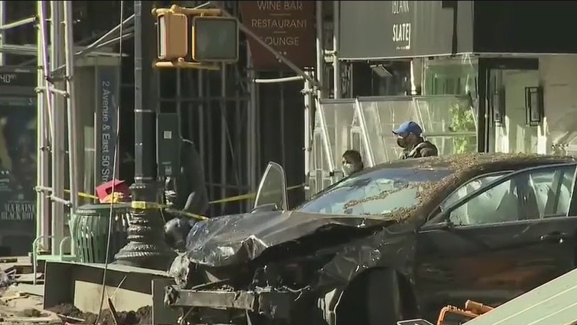 Van, car collide slamming into Manhattan outdoor dining area, food stand